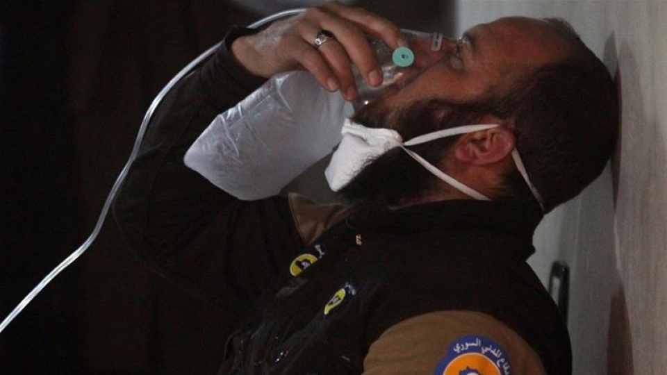 094841_A_civil_defence_member_breathes_through_an_oxygen_mask_after_a_suspected_gas_attack_in_the_town_of_Khan_Sheikhoun_Syria_April_4_2017._Reuters.jpg